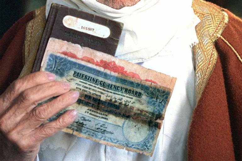 Mahmoud Dakwar, a 92 year-old Palestinian refugee from Safad in Northern Israel, shows 30 April his passport issued in 1943 by the "Palestinian government" under British mandate, as well as Palestinian currency issued before the creation of Israel in 1948, in his house in Bourj al-Shamali refugee camp, South Lebanon. Dakwar, along with 700,000 Palestinians, fled from Palestine to Lebanon after the defeat of Arab armies in 1948 following the creation of the State of Israel. (FILM) (Photo by RAMZI HAIDAR / AFP)